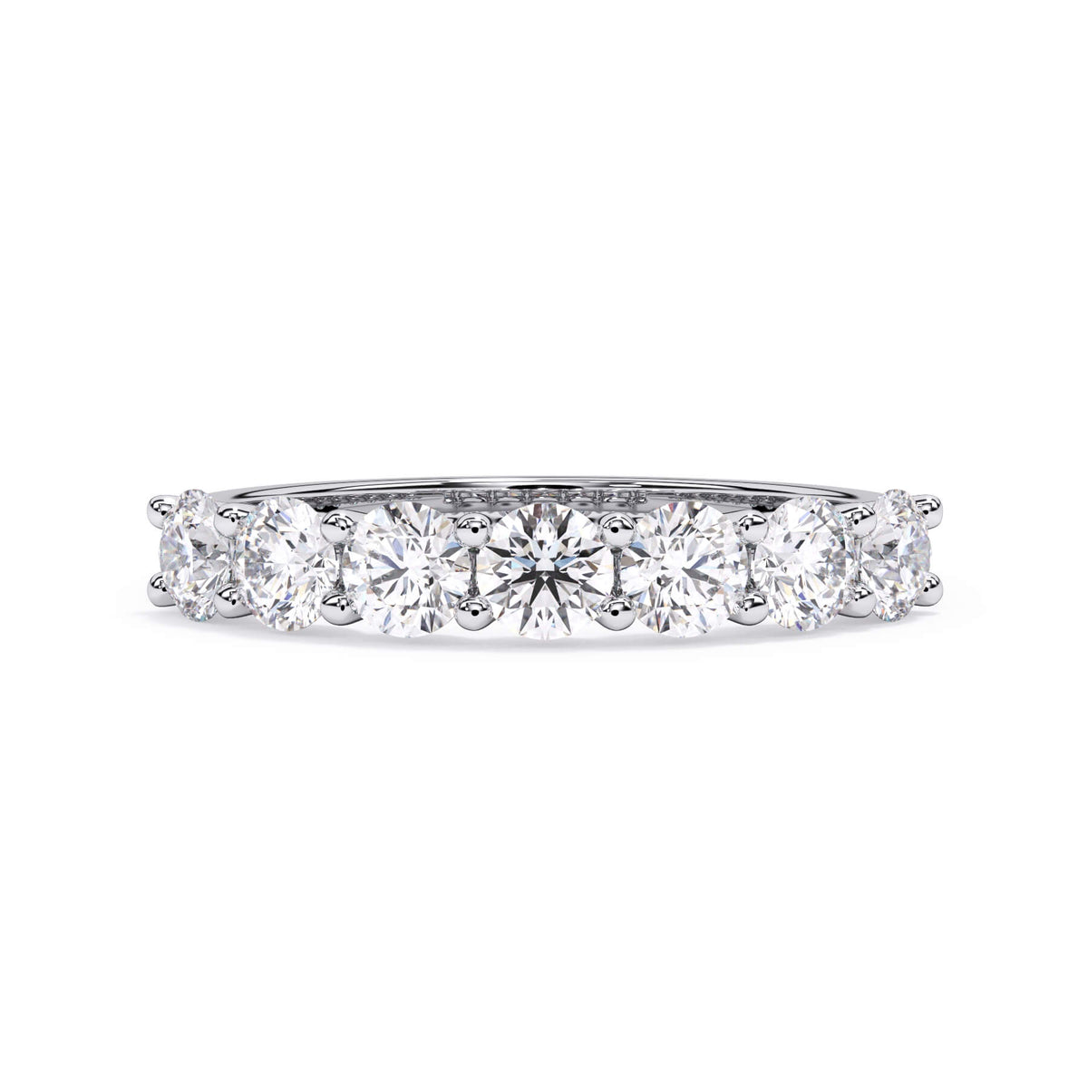 A picture of a seven stone diamond wedding ring with round diamonds that are U prong set in white gold or platinum on a white background with the ring facing forward, lying down.