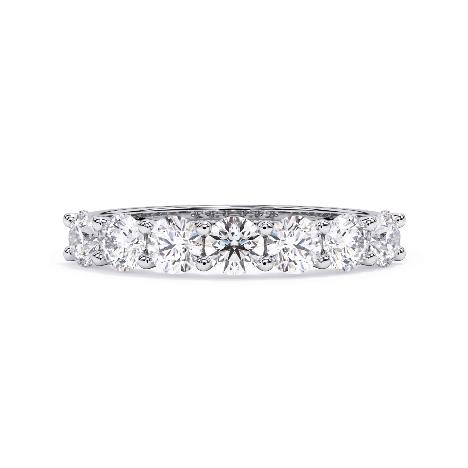 A picture of a seven stone diamond wedding ring with round diamonds that are U prong set in white gold or platinum on a white background with the ring facing forward, lying down.