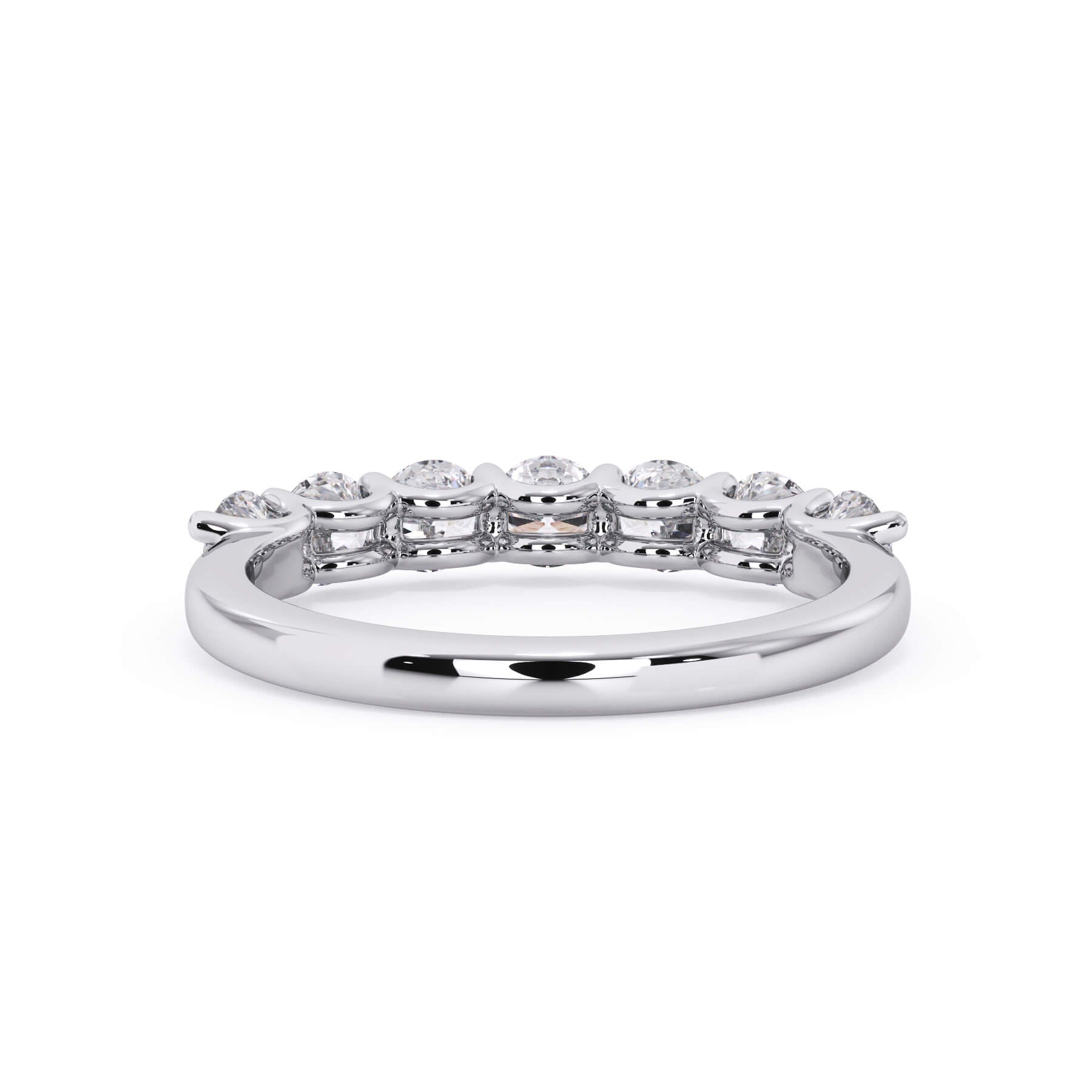 A picture of a seven stone diamond wedding ring with round diamonds that are U prong set in white gold or platinum on a white background with a view of the underside of the ring.
