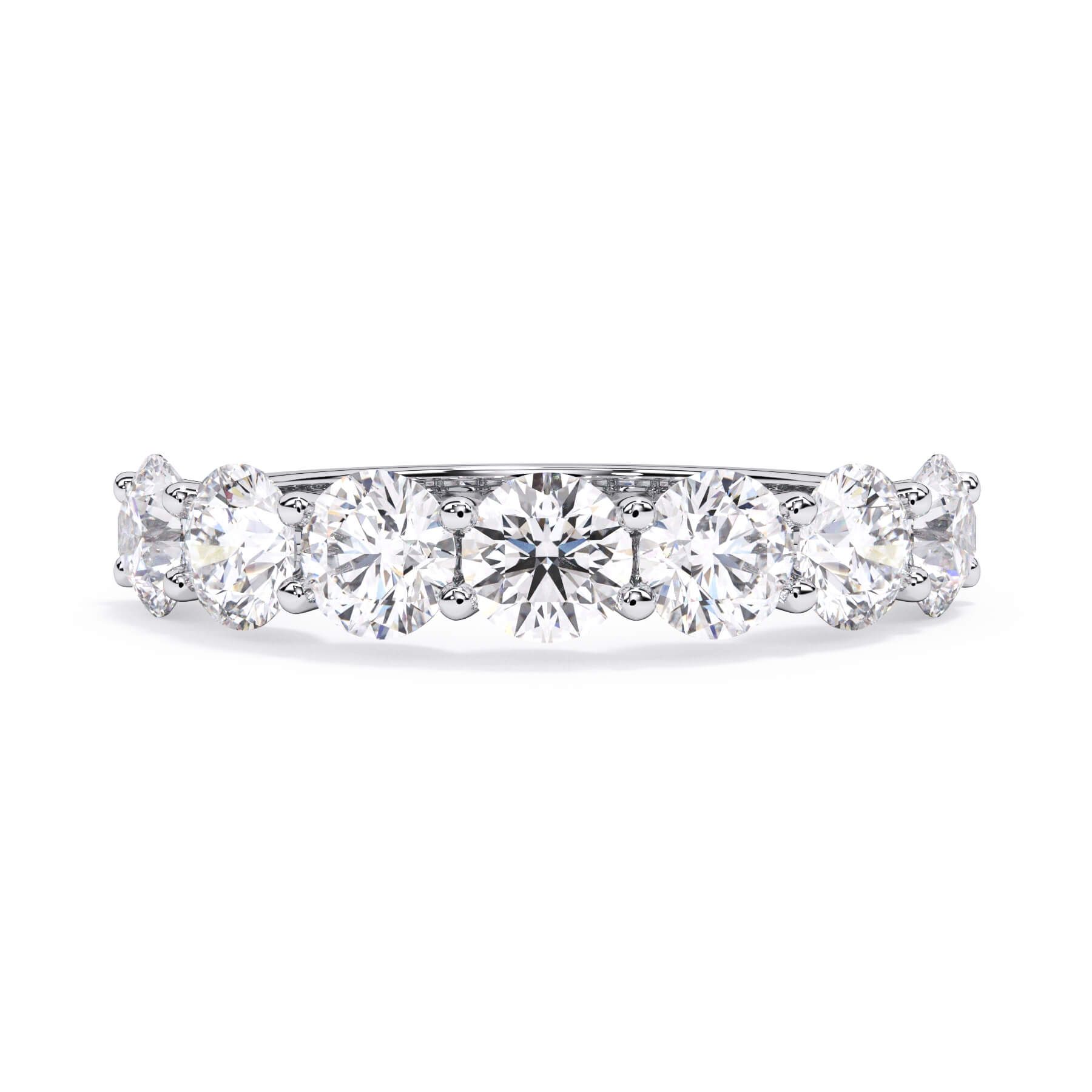 A picture of a seven stone diamond wedding ring with round diamonds that are U prong set in white gold or platinum on a white background with the ring facing forward, lying down.