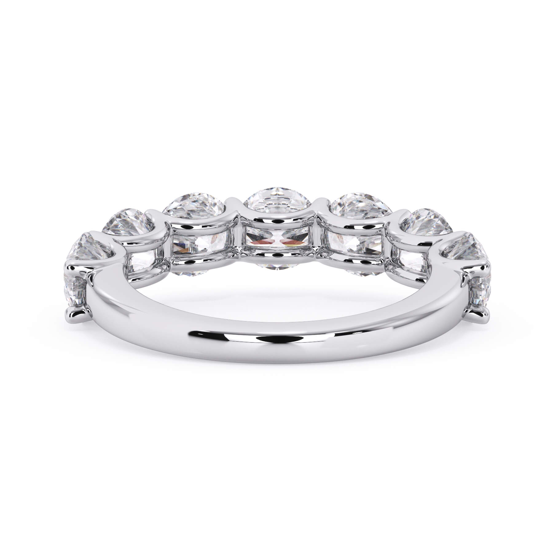 A picture of a seven stone diamond wedding ring with round diamonds that are U prong set in white gold or platinum on a white background with a view of the underside of the ring.