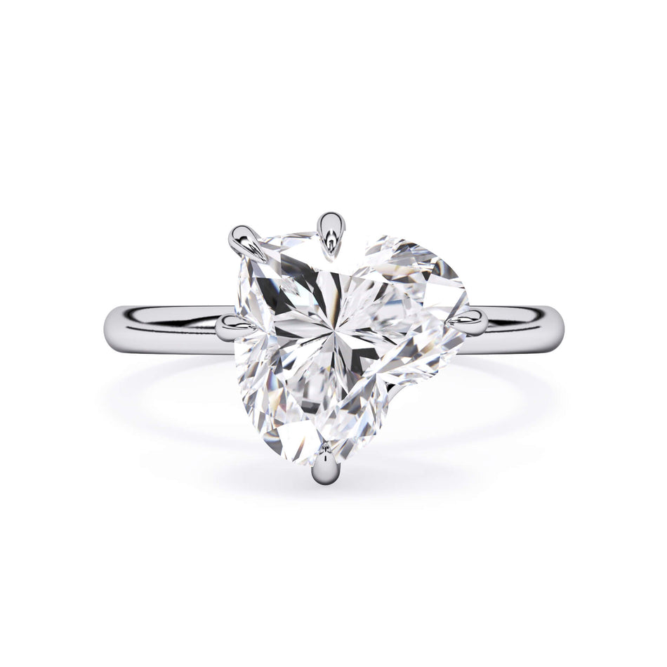 Tilted Head Solitaire Engagement Ring Setting (SKU: HE512) Shown with Heart Shape Diamond  in White Gold or Platinum - Front View