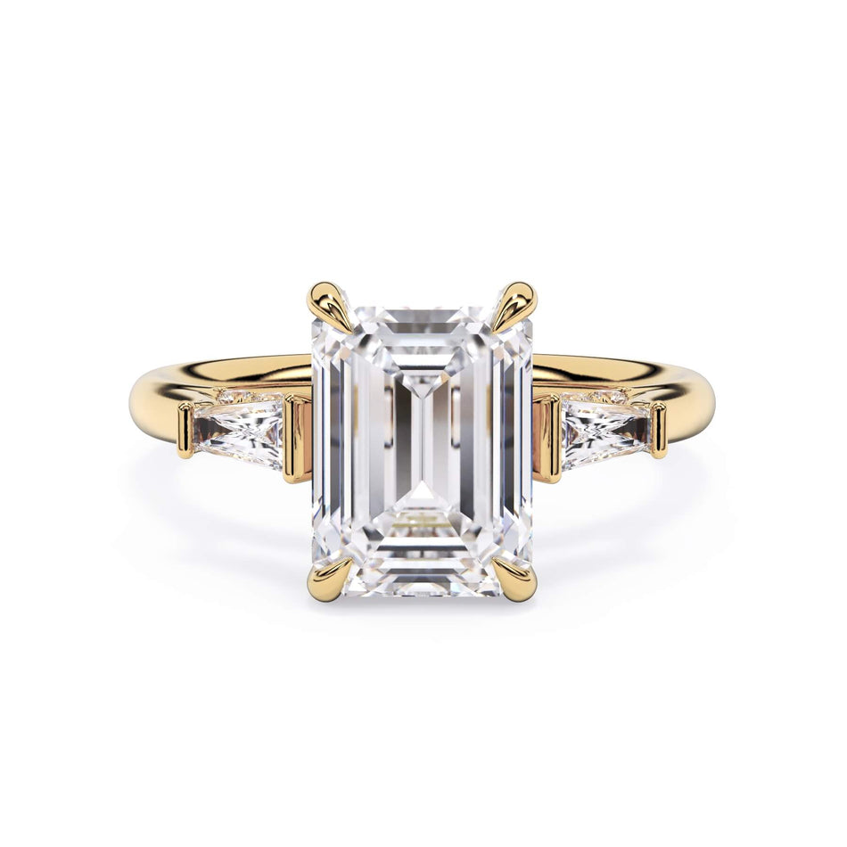 Three Stone Cathedral Diamond Setting (SKU: HE-518) Shown with Emerald Shape Diamond in Yellow Gold  - Front View