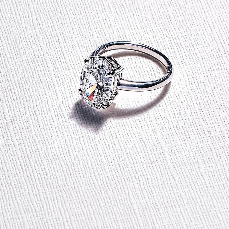 Oval Diamond White Gold Engagement Ring on a Canvas background.
