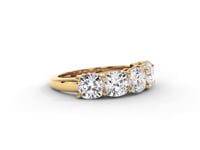 A video of a five stone diamond wedding ring that changes in color from white metal, to yellow, to rose gold on a white background.