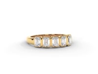 A video of a five stone diamond wedding ring that changes in color from white metal, to yellow, to rose gold on a white background.