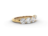 A video of a five stone diamond wedding ring that changes in color from white metal, to yellow, to rose gold on a white background.