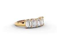 A video of a five stone diamond wedding ring that changes in color from white metal, to yellow, to rose gold on a white background.
