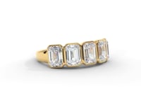 A video of a five stone diamond wedding ring that changes in color from white metal, to yellow, to rose gold on a white background.