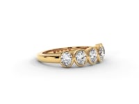 A video of a five stone diamond wedding ring that changes in color from white metal, to yellow, to rose gold on a white background.