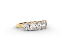 A video of a five stone diamond wedding ring that changes in color from white metal, to yellow, to rose gold on a white background.