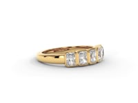 A video of a five stone diamond wedding ring that changes in color from white metal, to yellow, to rose gold on a white background.