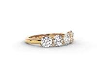 A video of a five stone diamond wedding ring that changes in color from white metal, to yellow, to rose gold on a white background.