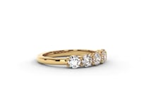 A video of a five stone diamond wedding ring that changes in color from white metal, to yellow, to rose gold on a white background.