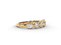 A video of a five stone diamond wedding ring that changes in color from white metal, to yellow, to rose gold on a white background.