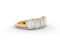 A video of a five stone diamond wedding ring that changes in color from white metal, to yellow, to rose gold on a white background.