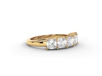 A video of a five stone diamond wedding ring that changes in color from white metal, to yellow, to rose gold on a white background.