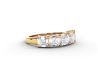 A video of a five stone diamond wedding ring that changes in color from white metal, to yellow, to rose gold on a white background.