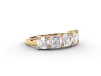 A video of a five stone diamond wedding ring that changes in color from white metal, to yellow, to rose gold on a white background.