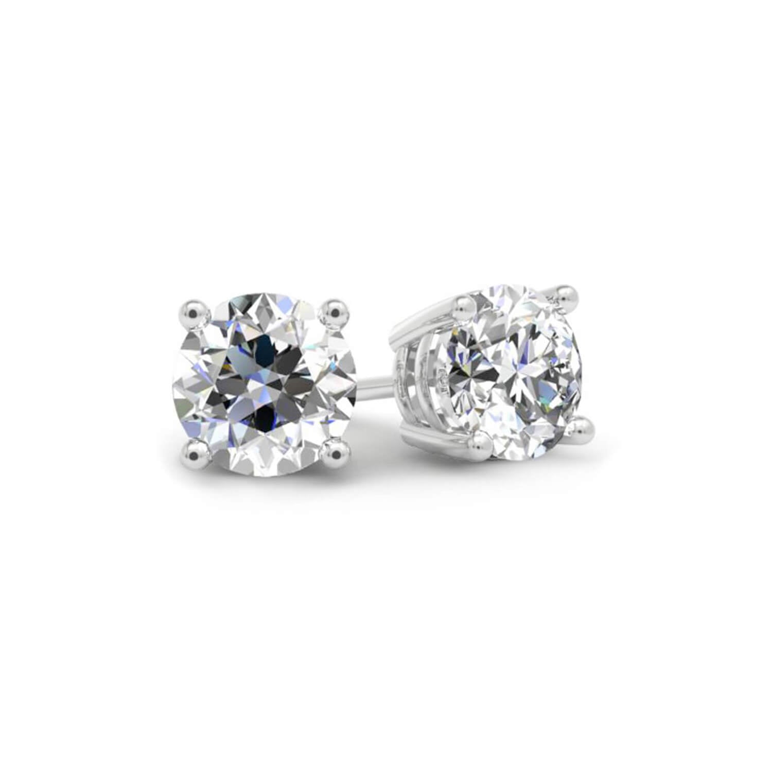 Pair of diamond stud earrings on a white background