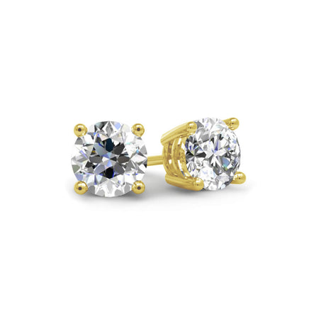 Gold stud earrings with clear gemstones on a white background