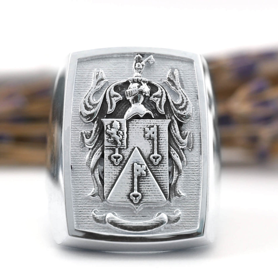 Raised Family Crest Signet Ring - Shown in White Gold with Lavender in the Background