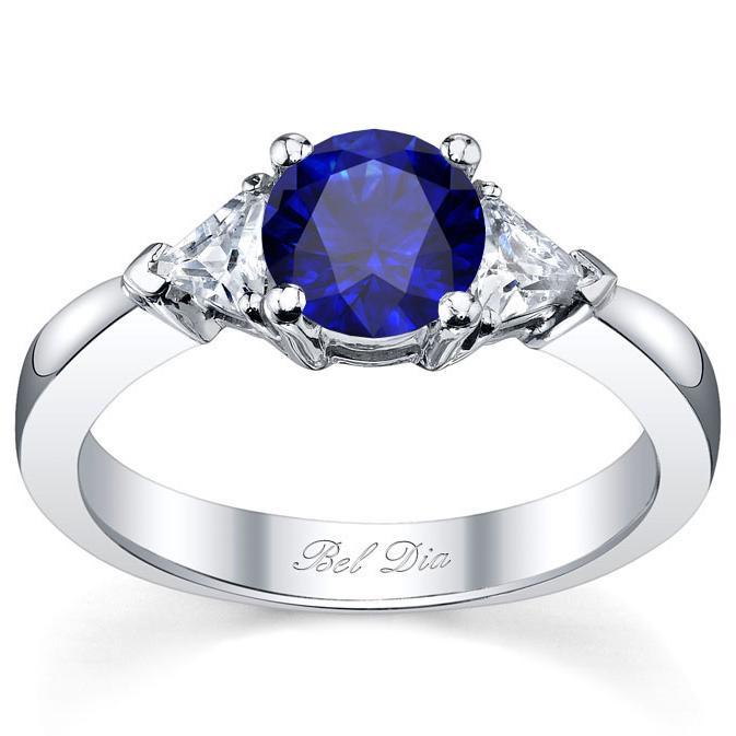 Blue Sapphire Three Stone Ring with Trillions Sapphire Engagement Rings deBebians 